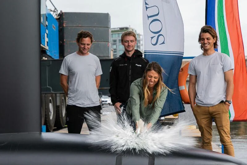 a group of people standing next to a fire hydrant aboard SORVIND Yacht for Charter