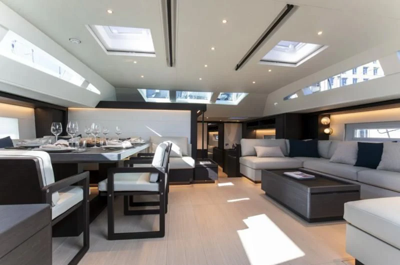 a room with a couch and a table and chairs aboard SORVIND Yacht for Charter