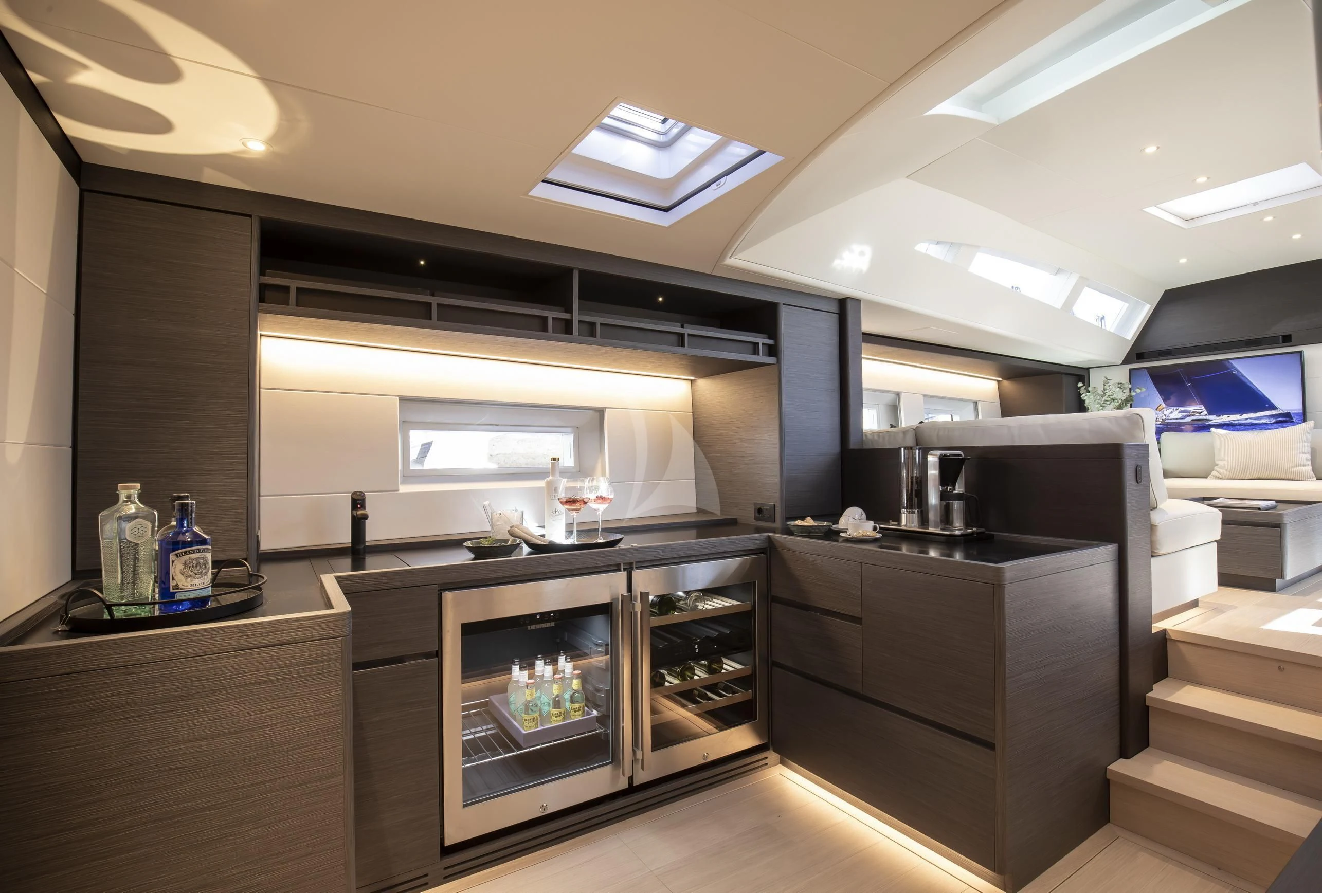a kitchen with a large open refrigerator aboard SORVIND Yacht for Charter