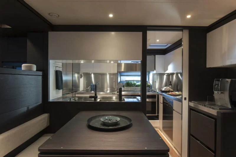 a kitchen with a large glass window aboard SORVIND Yacht for Charter