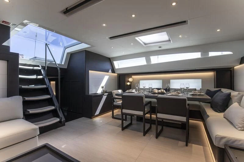 a room with a table and chairs aboard SORVIND Yacht for Charter