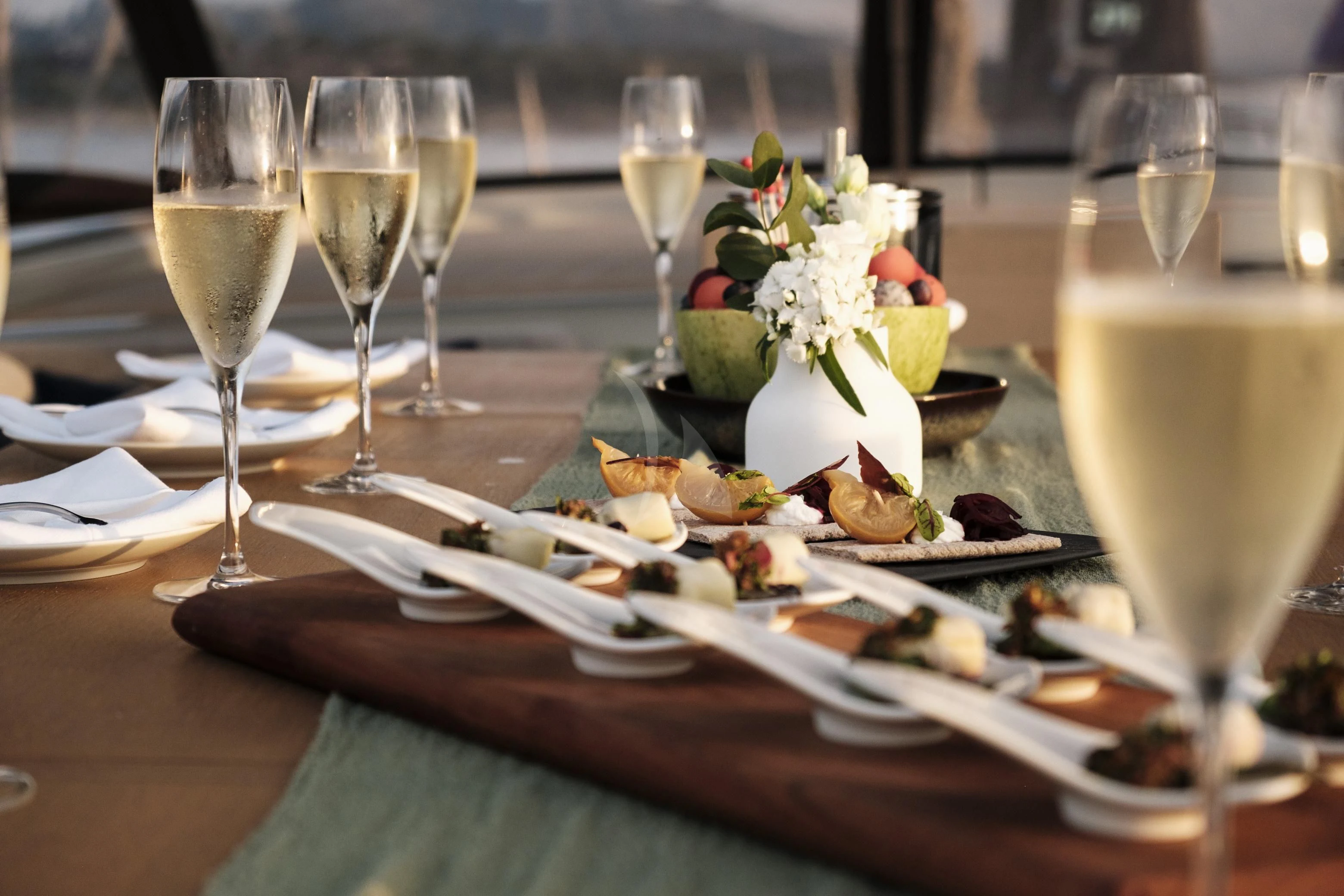 a table with food and wine aboard SORVIND Yacht for Charter
