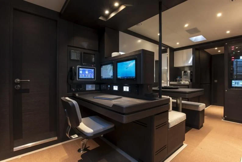a room with computers and chairs aboard SORVIND Yacht for Charter