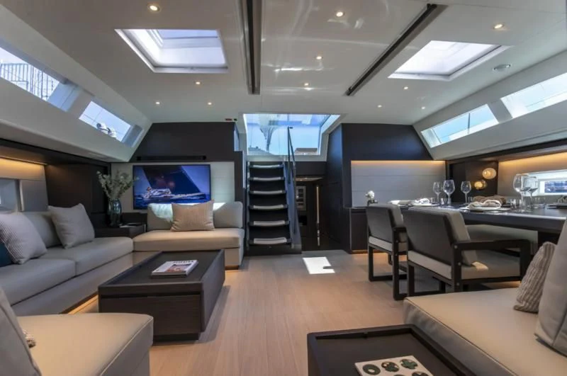a living room with a ladder aboard SORVIND Yacht for Charter