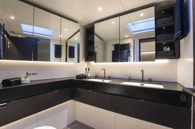 a bathroom with a large mirror aboard SORVIND Yacht for Charter