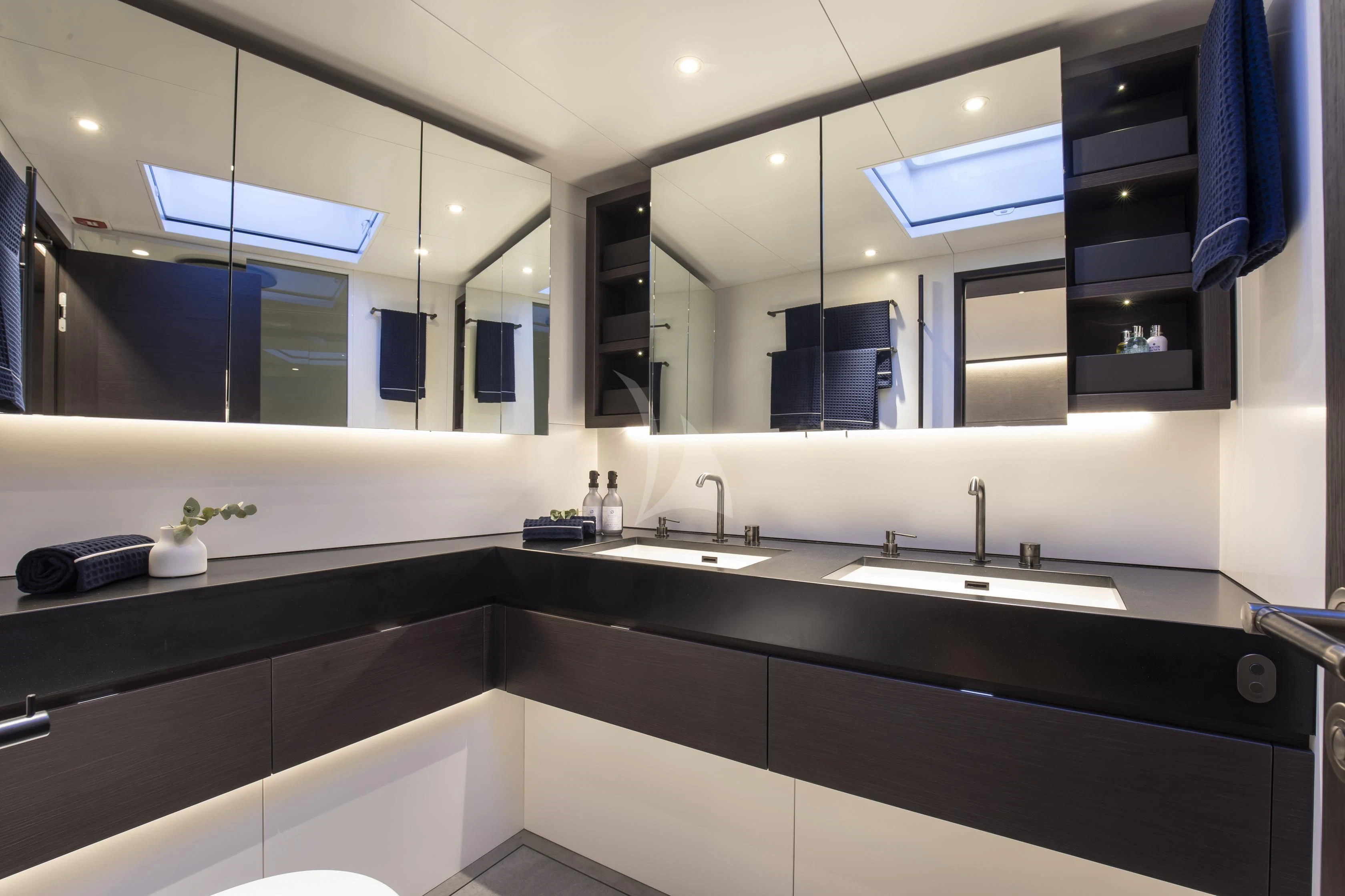 a bathroom with a large mirror aboard SORVIND Yacht for Charter