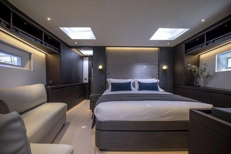 a large bedroom with a bed aboard SORVIND Yacht for Charter