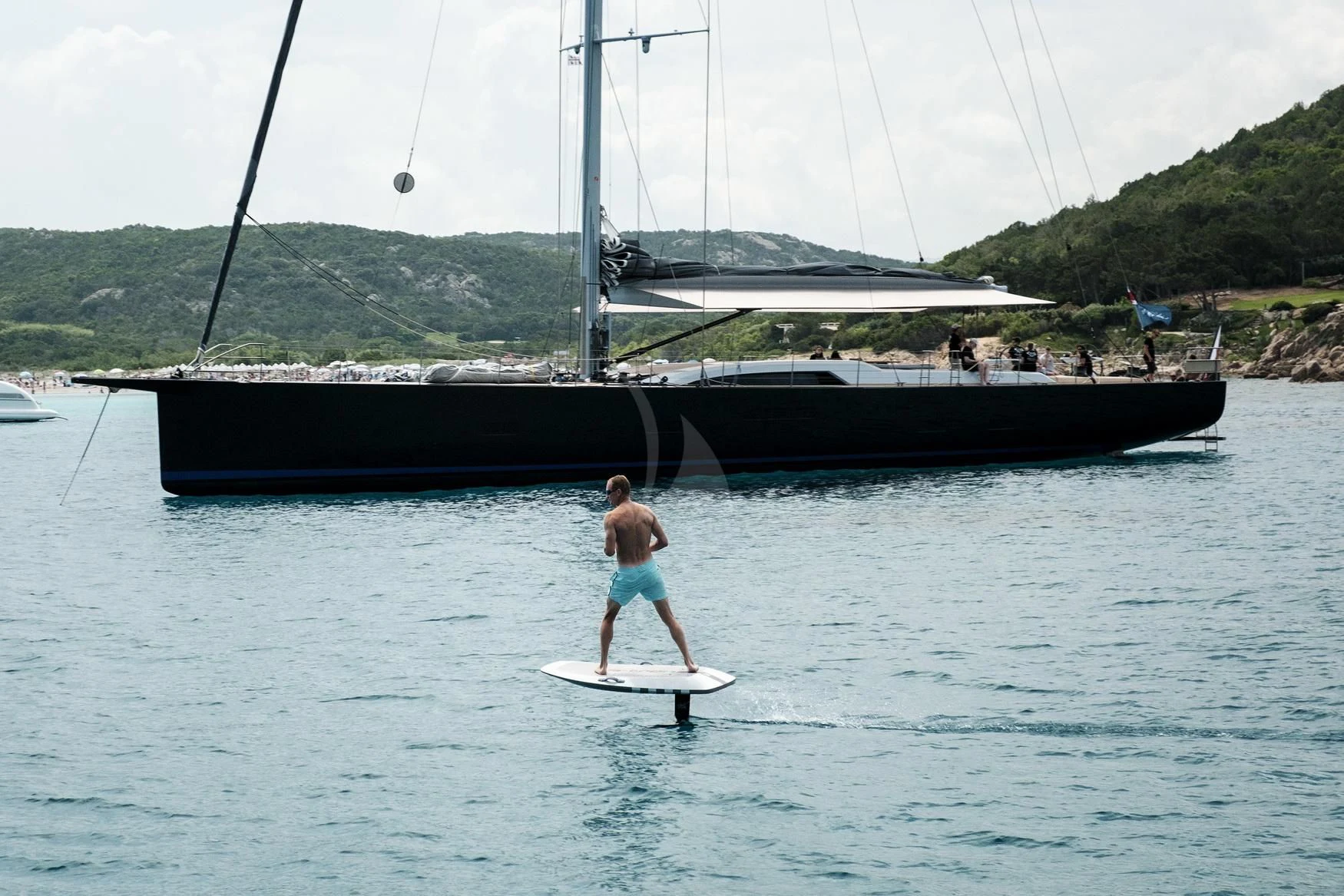 a man on a surfboard in the water aboard SORVIND Yacht for Charter
