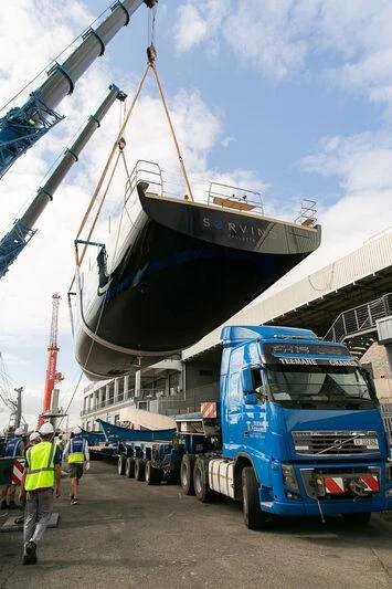 a crane lifting a boat aboard SORVIND Yacht for Charter