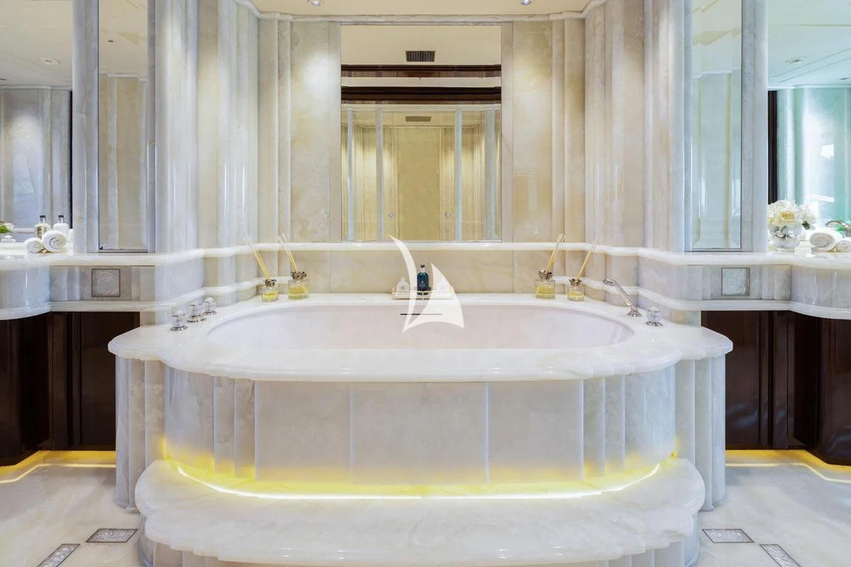 a bathroom with a bathtub and sink aboard ILLUSION V Yacht for Charter