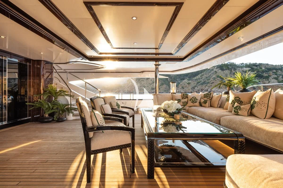 a living room with a large patio aboard ILLUSION V Yacht for Charter