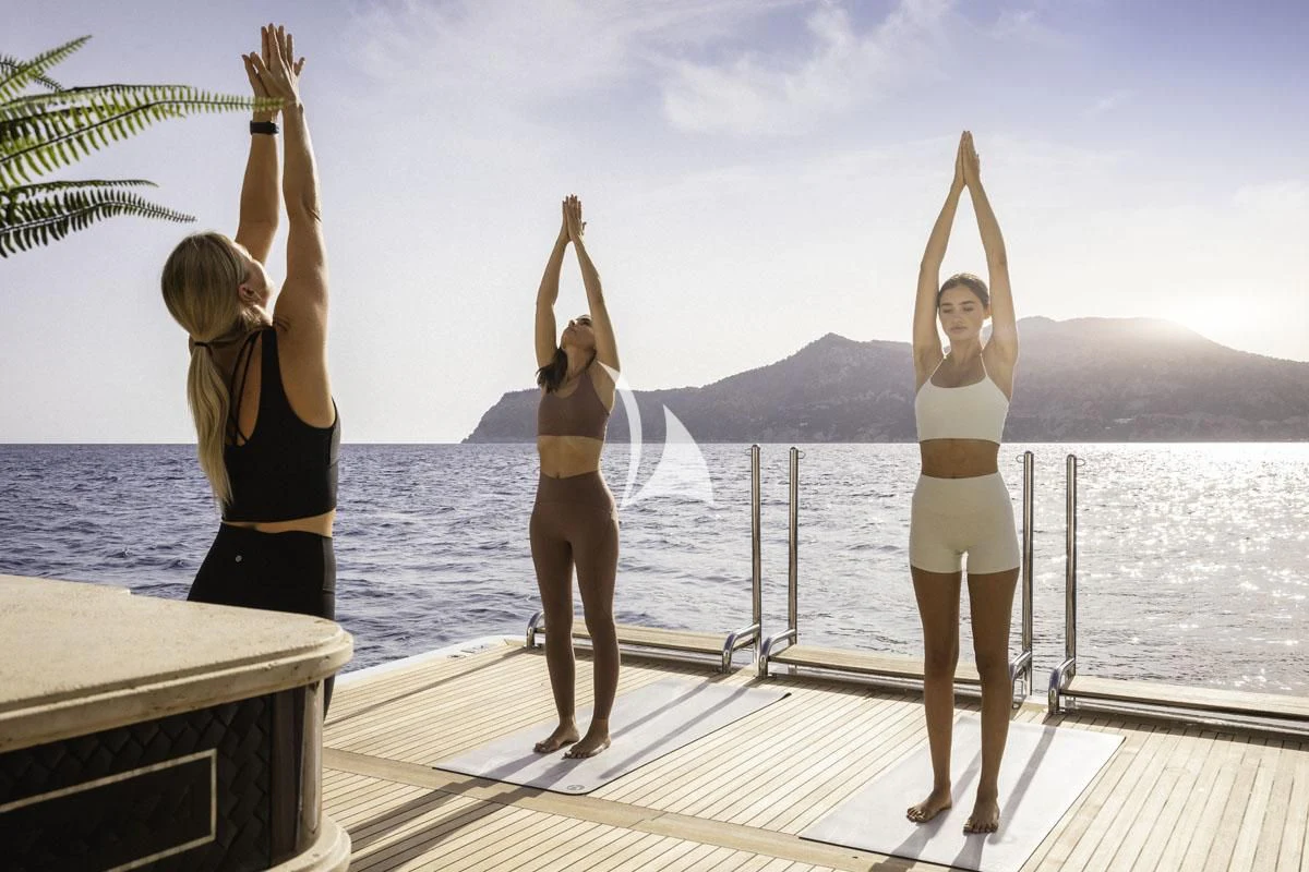 a group of women on a dock aboard ILLUSION V Yacht for Charter
