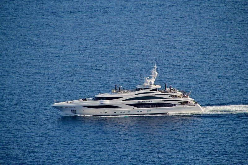 a white yacht in the water aboard ILLUSION V Yacht for Charter