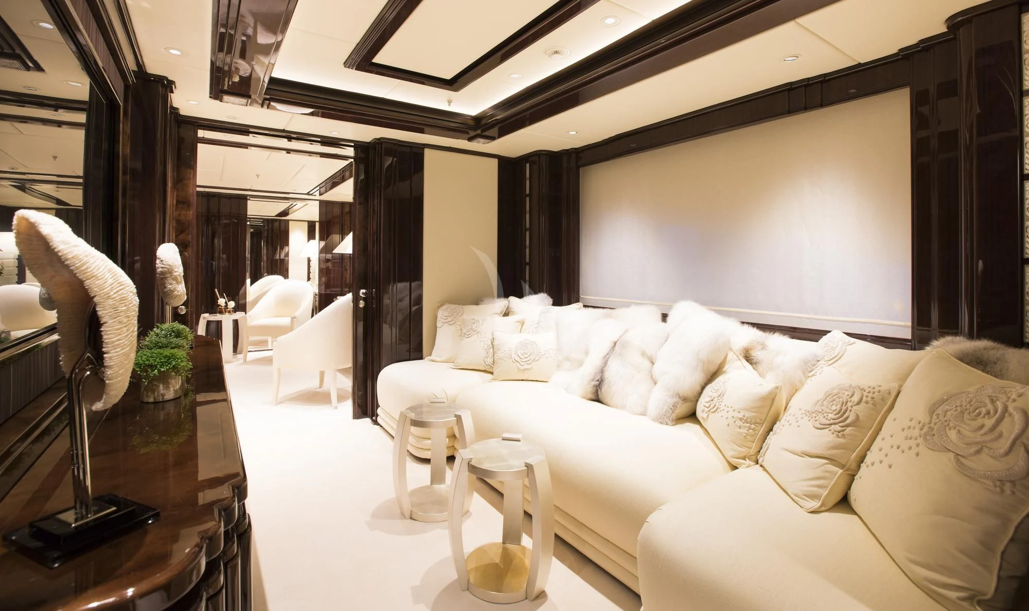 a living room with a couch and a table aboard ILLUSION V Yacht for Charter