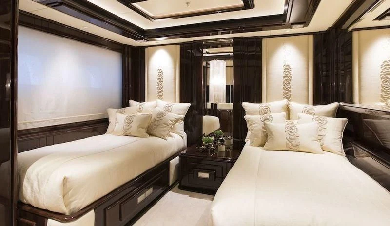 a room with two beds aboard ILLUSION V Yacht for Charter
