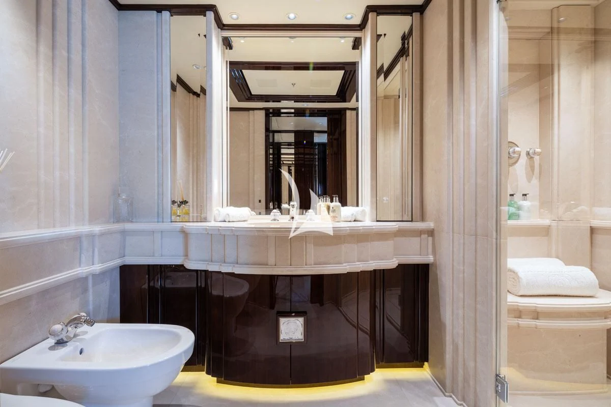 a bathroom with a sink and a mirror aboard ILLUSION V Yacht for Charter