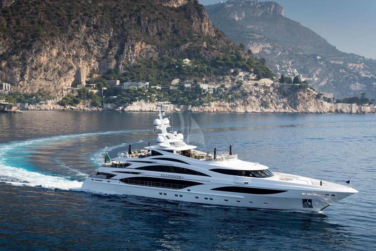 a white yacht on the water aboard ILLUSION V Yacht for Charter