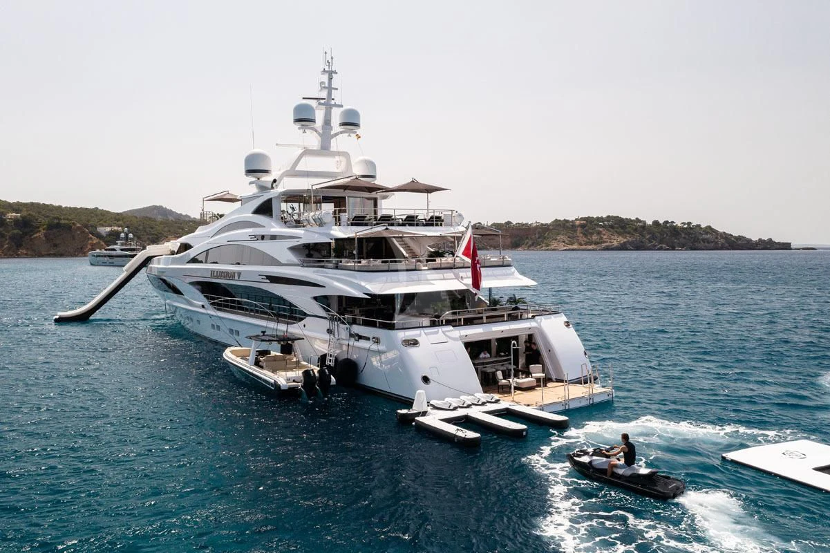 a large ship in the water aboard ILLUSION V Yacht for Charter