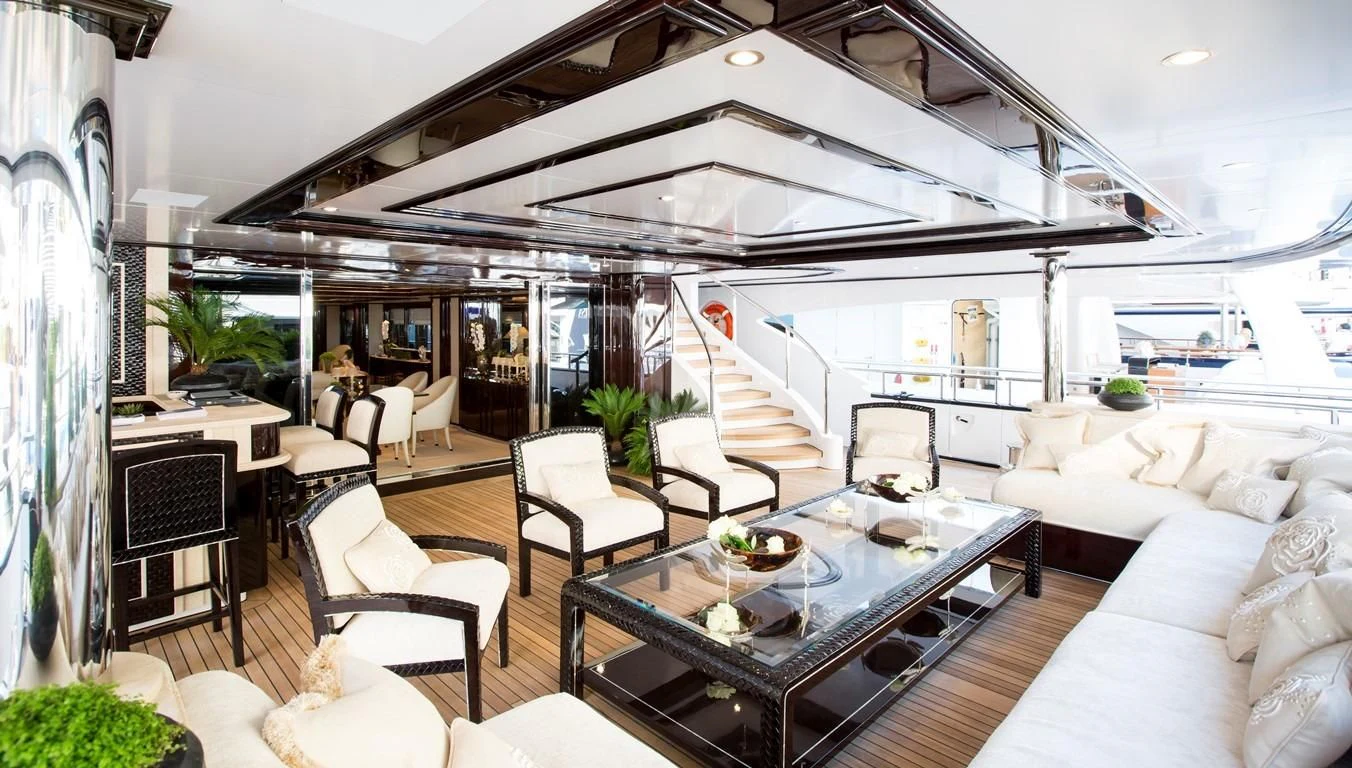 a living room with a large open roof aboard ILLUSION V Yacht for Charter