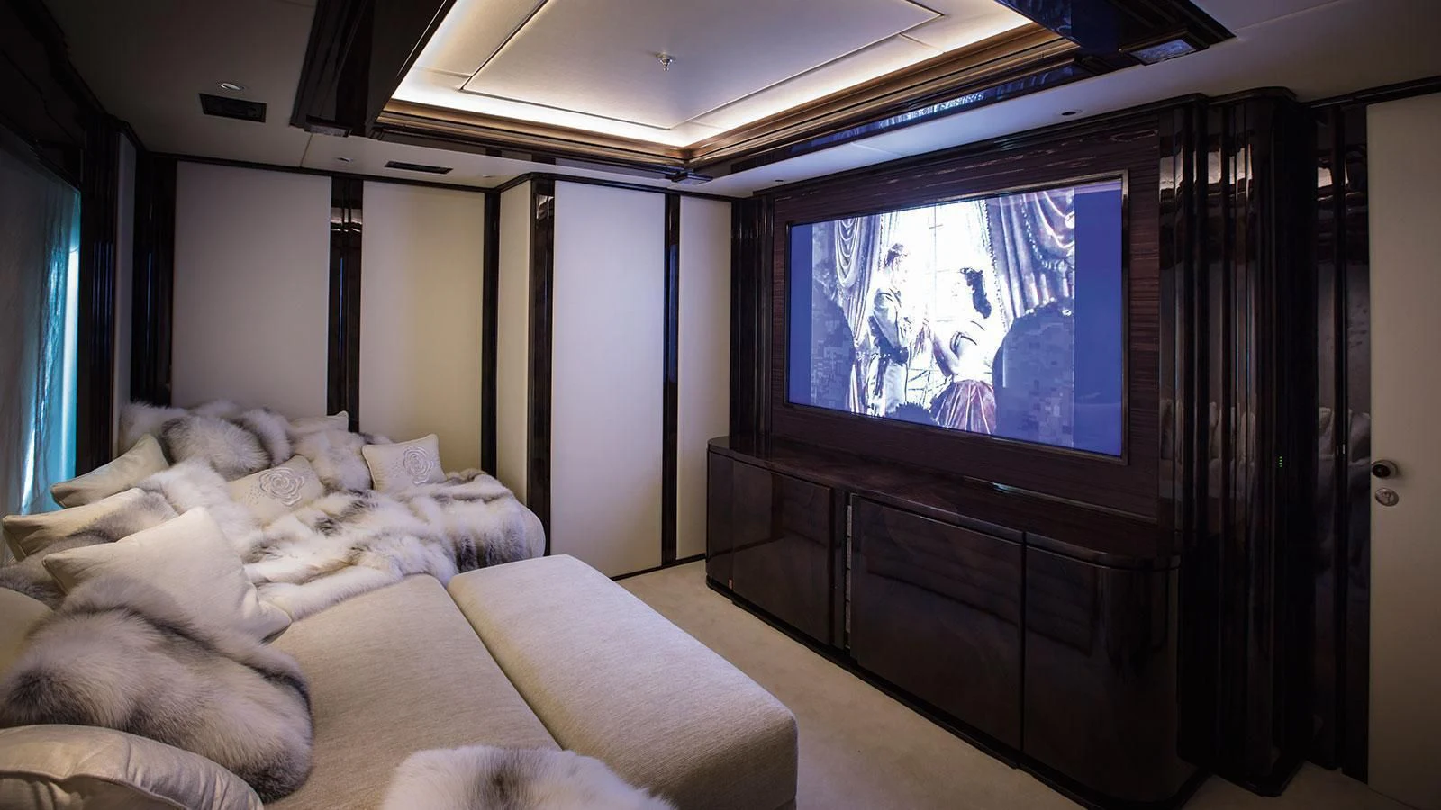 a tv on a wall aboard ILLUSION V Yacht for Charter