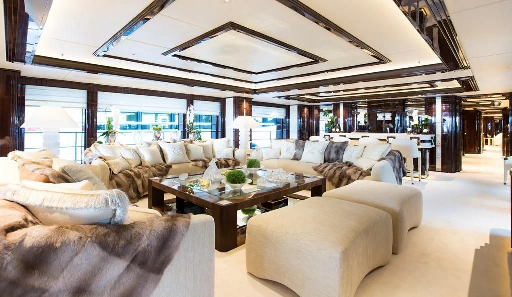 a living room with a large window aboard ILLUSION V Yacht for Charter
