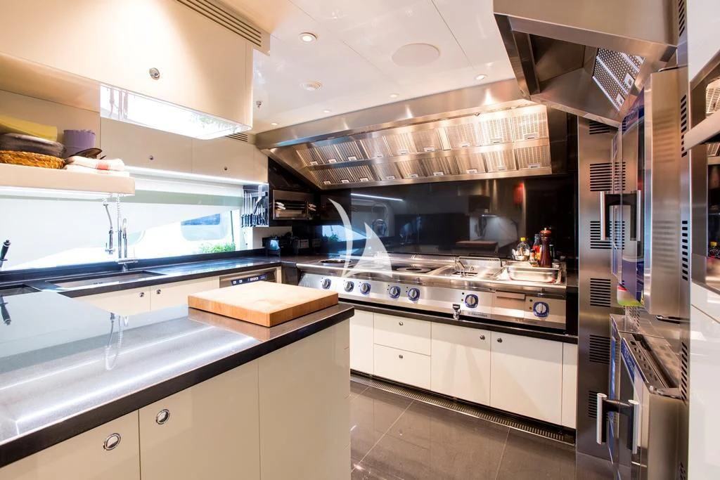 a kitchen with a large oven aboard ILLUSION V Yacht for Charter