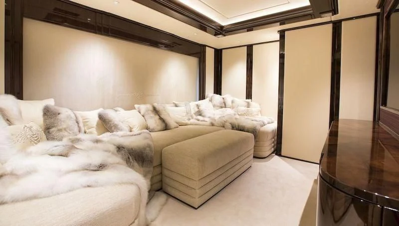 a room with a bed and a glass door aboard ILLUSION V Yacht for Charter