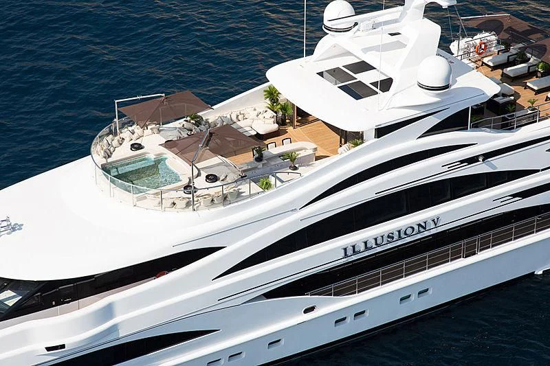 a white yacht in the water aboard ILLUSION V Yacht for Charter