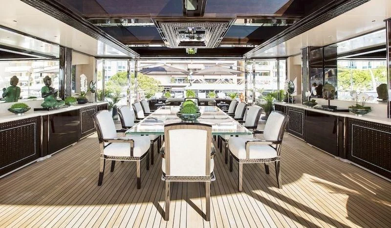 a large kitchen with a table and chairs aboard ILLUSION V Yacht for Charter