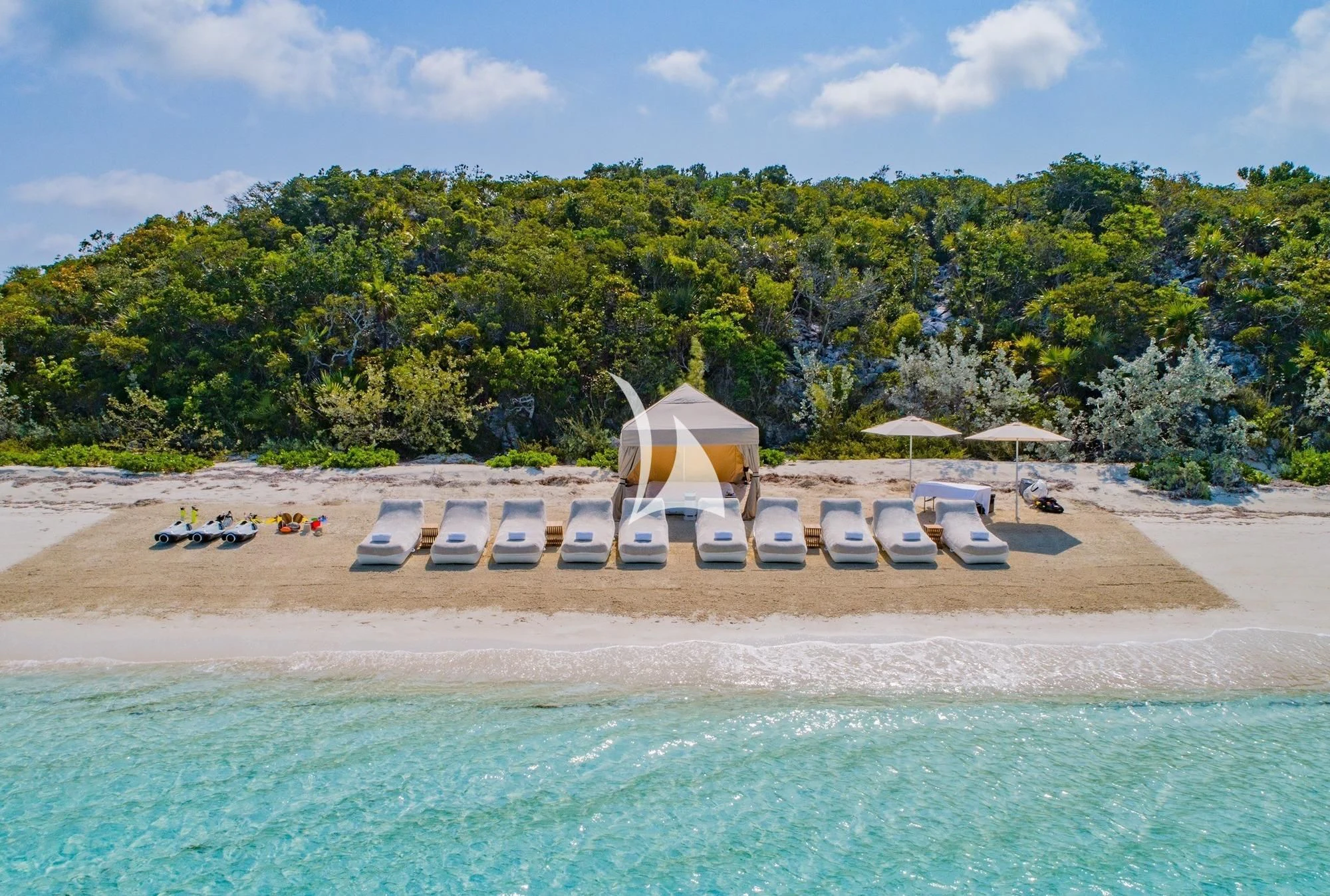 a pool with chairs and umbrellas by a beach aboard ILLUSION V Yacht for Charter