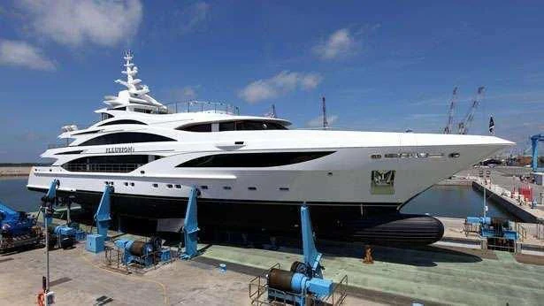 a large white yacht aboard ILLUSION V Yacht for Charter