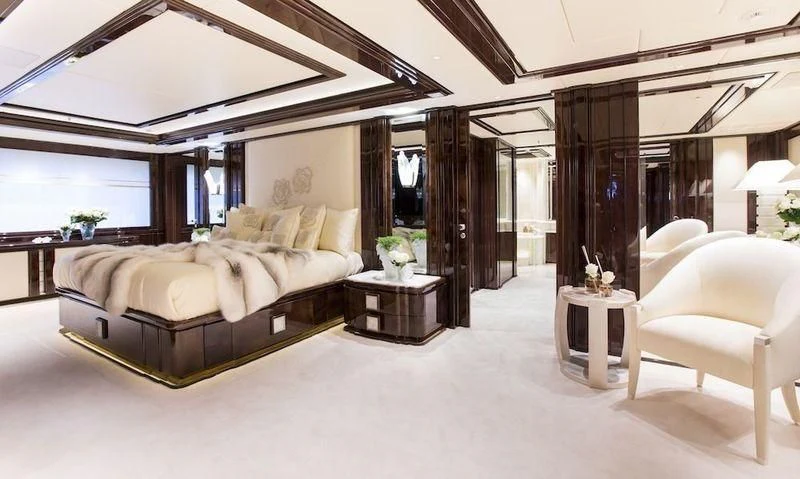 a large living room with a large window aboard ILLUSION V Yacht for Charter