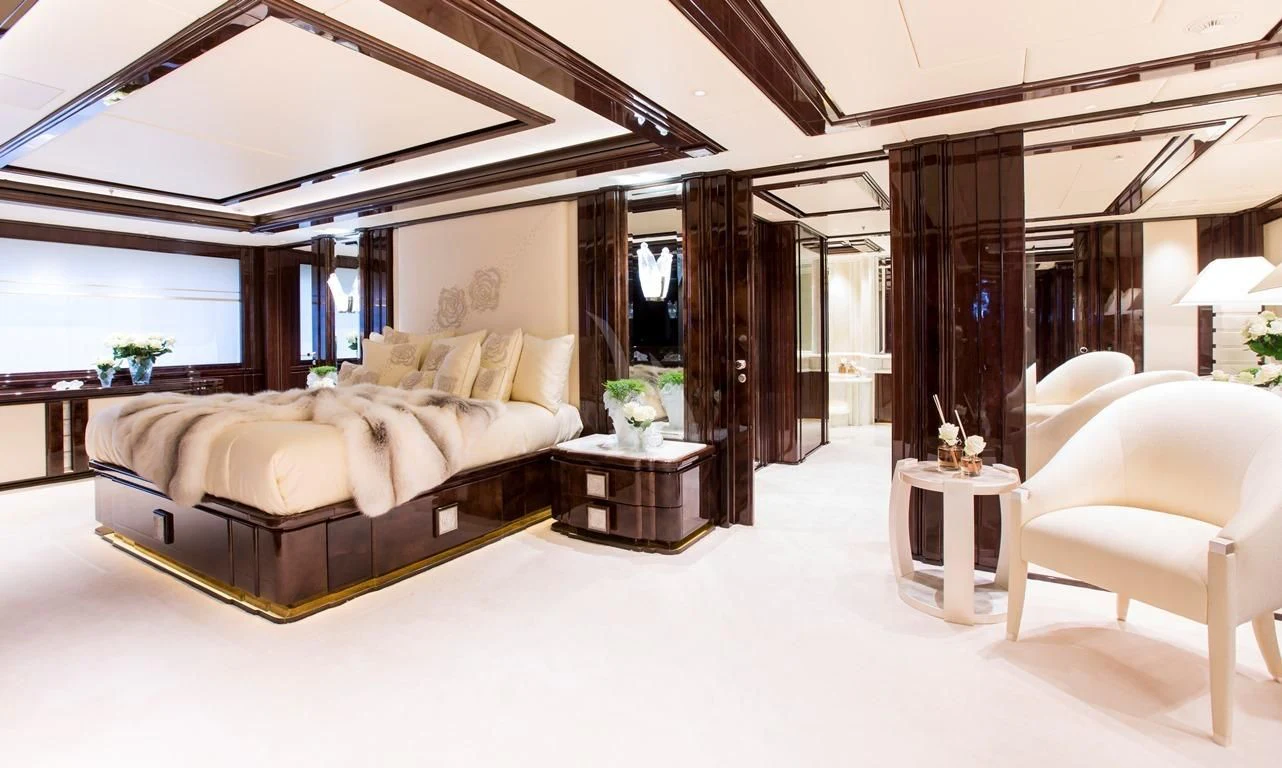 a large room with a couch and a table aboard ILLUSION V Yacht for Charter