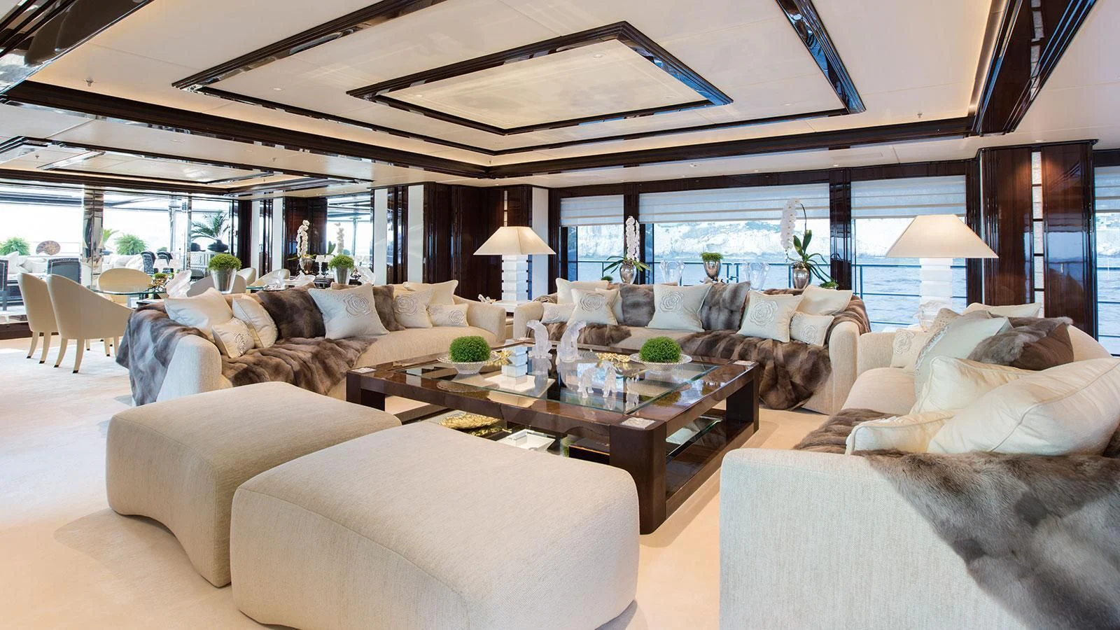 a living room with a large window aboard ILLUSION V Yacht for Charter