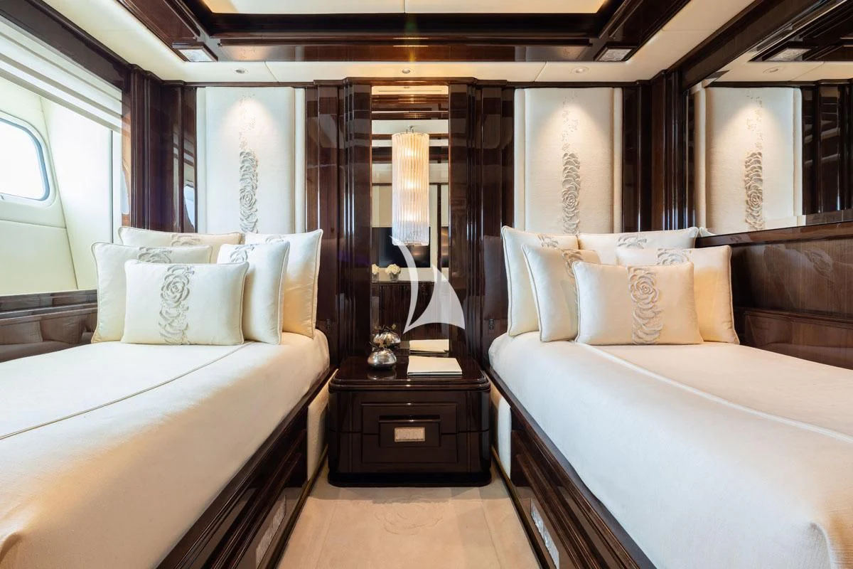 a room with two beds aboard ILLUSION V Yacht for Charter