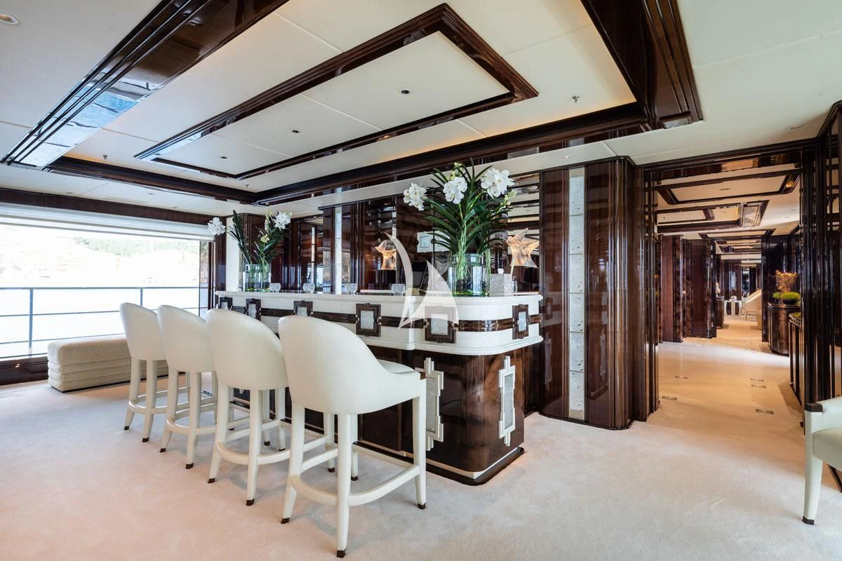 a room with a table and chairs aboard ILLUSION V Yacht for Charter