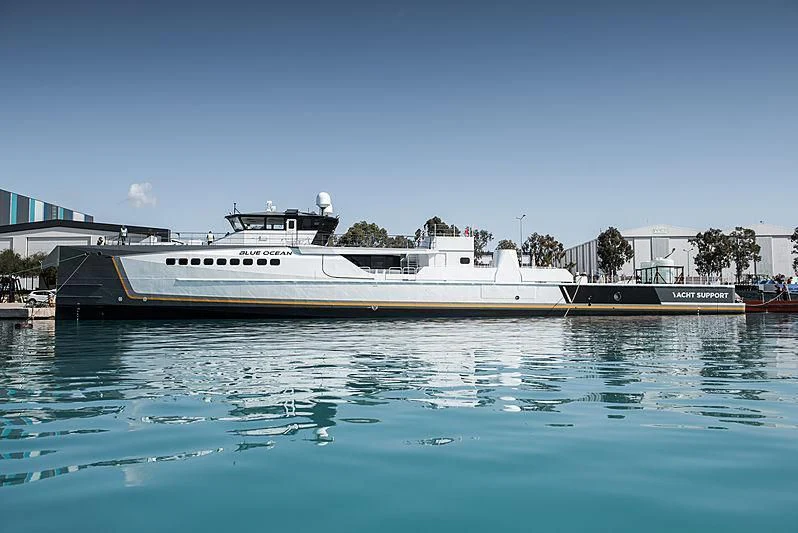 a large white boat in a harbor aboard GENE CHASER Yacht for Sale