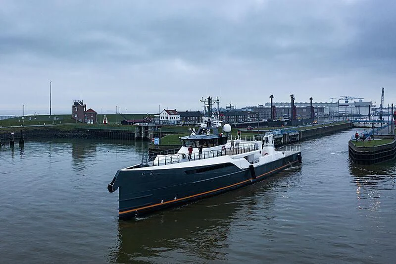 a boat docked at a pier aboard GENE CHASER Yacht for Sale
