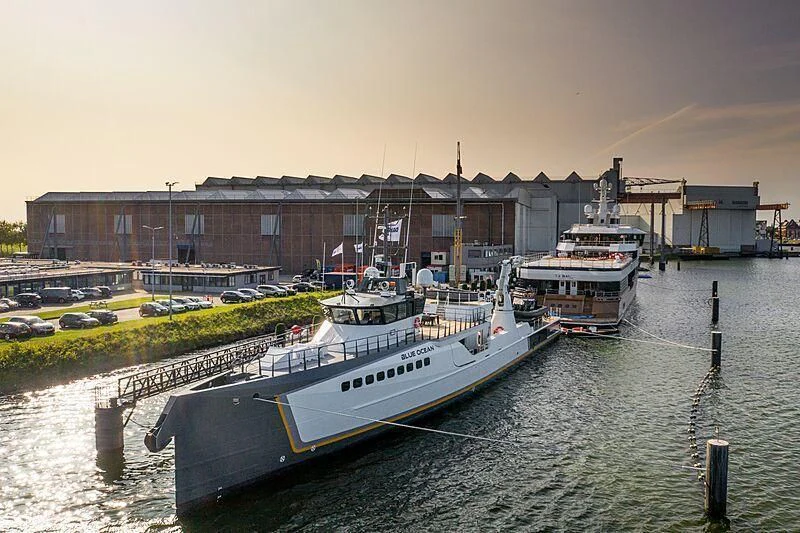 a boat is parked on the side of the water aboard GENE CHASER Yacht for Sale