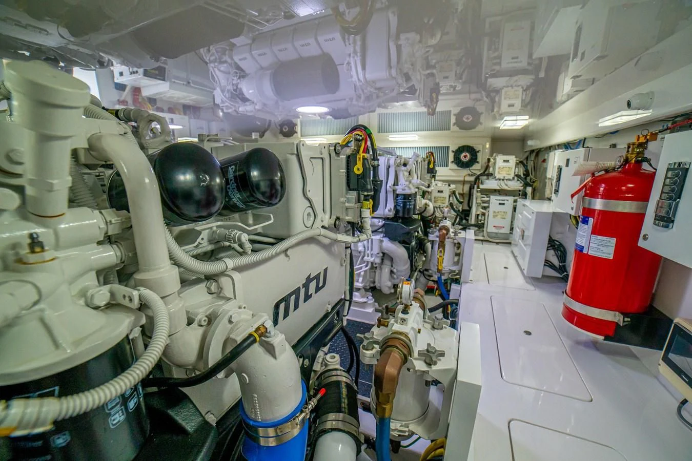 a room full of white and blue machinery aboard MANA Yacht for Sale