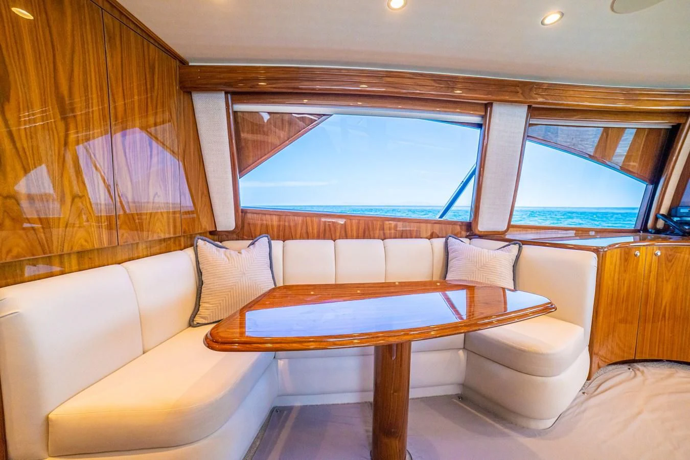a room with a couch and a table aboard MANA Yacht for Sale