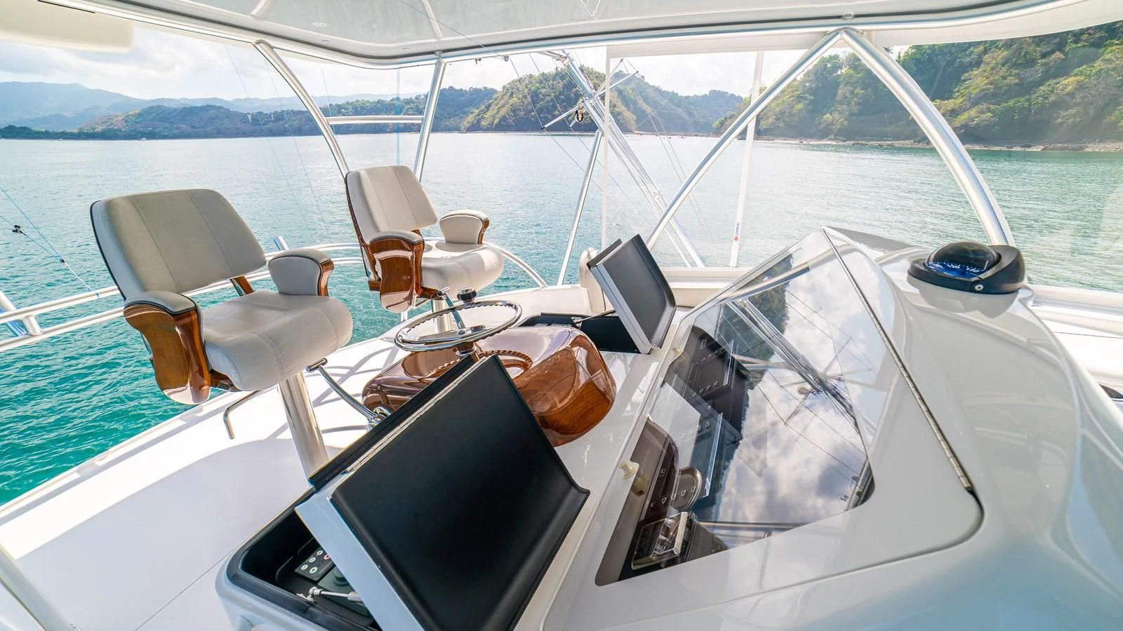 a boat with a group of seats on it aboard MANA Yacht for Sale