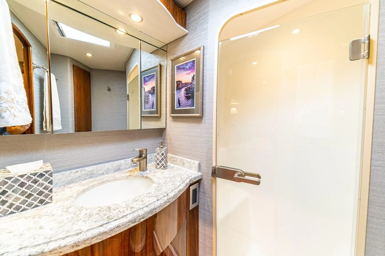 a bathroom with a large mirror aboard MANA Yacht for Sale