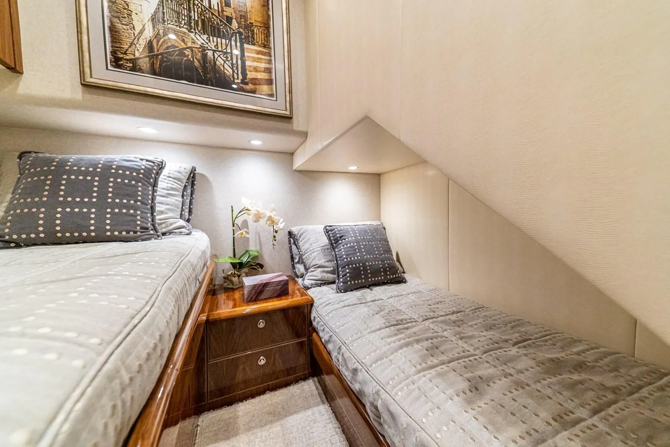 a couple of beds in a room aboard MANA Yacht for Sale