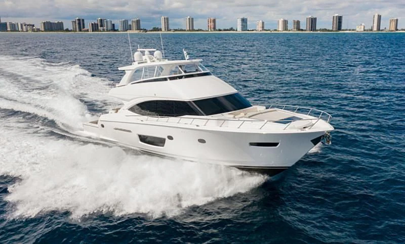 a white yacht on the water aboard MANA Yacht for Sale