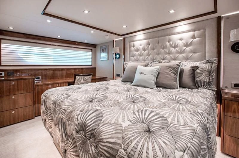 a bedroom with a large bed aboard MANA Yacht for Sale