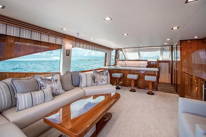 a living room with a large window aboard MANA Yacht for Sale