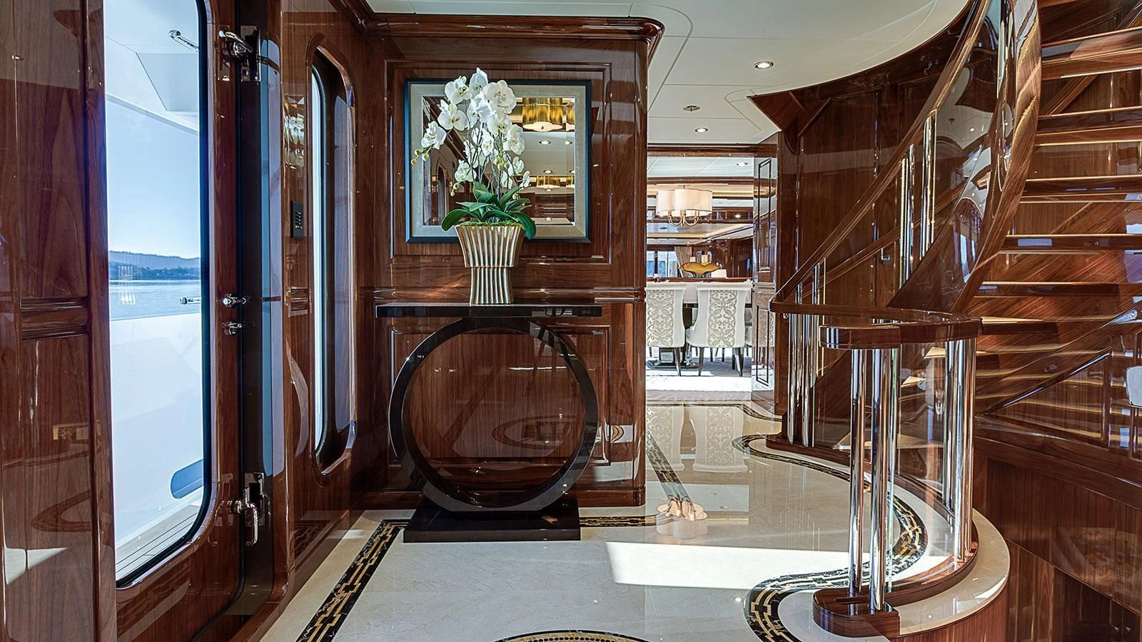 a room with a fireplace and a vase on the fireplace aboard D'NATALIN IV Yacht for Sale