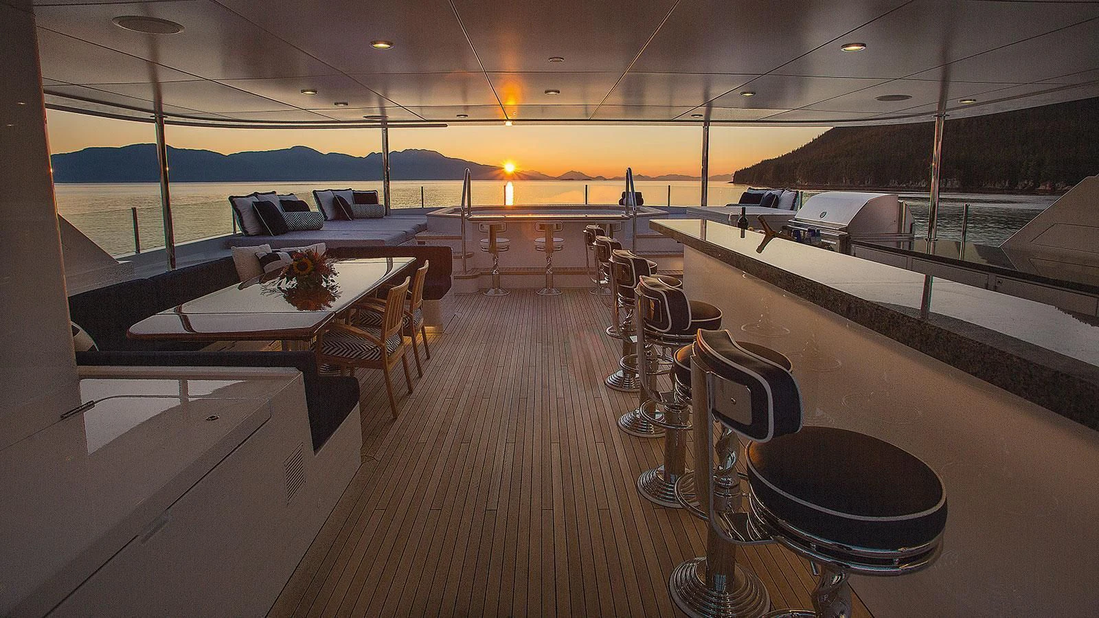 a room with tables and chairs aboard D'NATALIN IV Yacht for Sale
