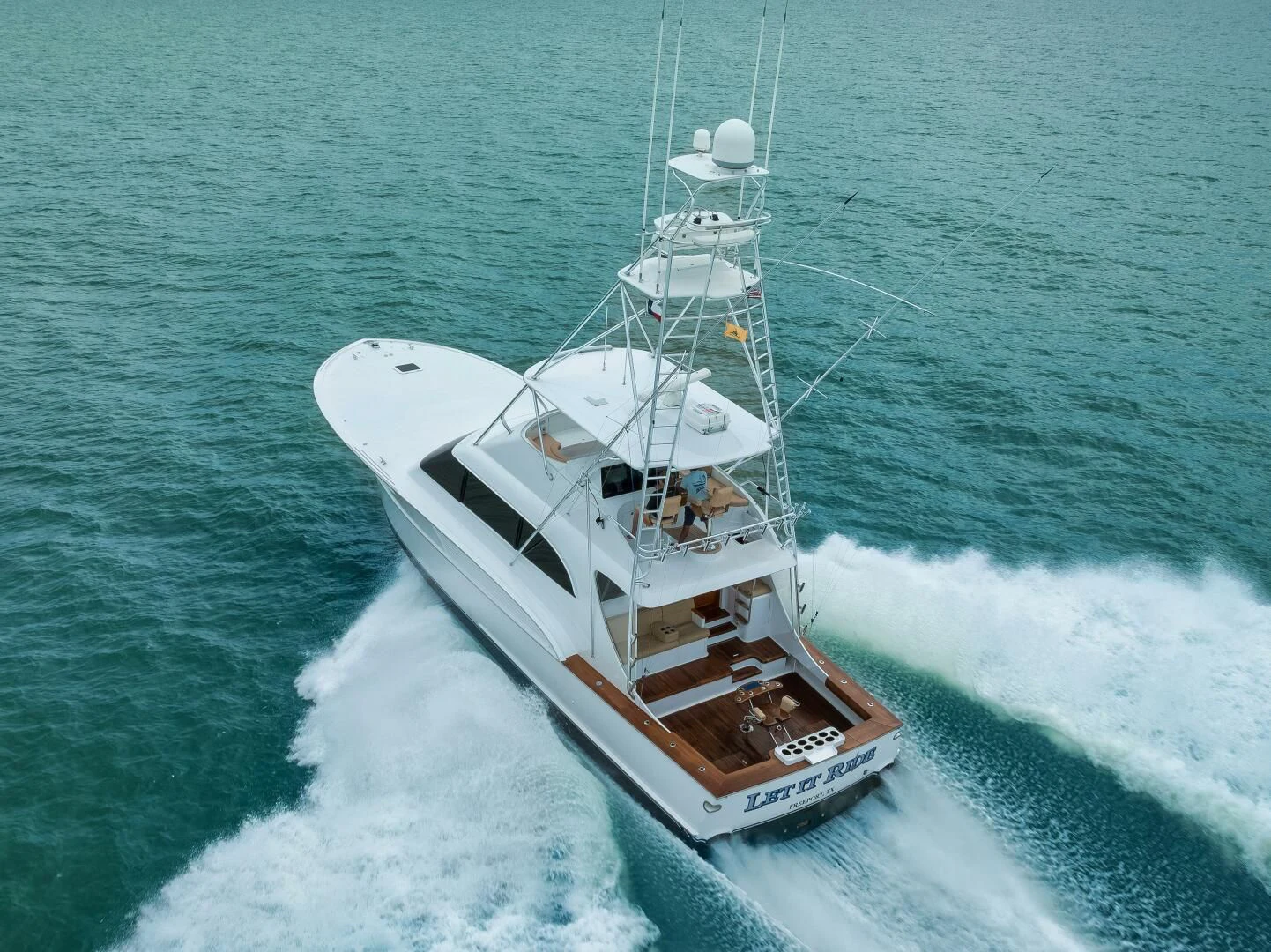 a boat on the water aboard LET  RIDE Yacht for Sale